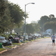 A person walks down a street as residents begin the process of cleaning up the damage to their property after torrential rains caused widespread flooding during Hurricane and Tropical Storm Harvey on September 1, 2017 in Houston, Texas.